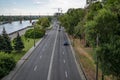 Beautiful city landscape of Sicheslavskaya embankment street in Dnipro Ukraine. A highway with cars along Dnieper river and the