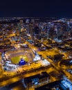 Beautiful city at night with baseball field in foreground Royalty Free Stock Photo