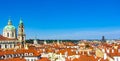 Beautiful city panorama, red roofs, and blue sky. Prague Royalty Free Stock Photo