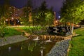 Beautiful city park on the outskirts of the city. View at night, with backlight, long exposure. Royalty Free Stock Photo