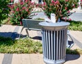 Full trash can in a city park Royalty Free Stock Photo