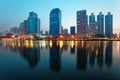 Beautiful city skyline of Bangkok at dawn with lakeside skyscrapers and reflections Royalty Free Stock Photo