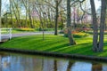 Beautiful city spring park. The park contains an artificial pond, a decorative lawn, flower beds Royalty Free Stock Photo
