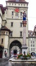 Beautiful City Street View of the colorful medieval Anna Seiler statue on top of elaborate fountain in Bern, Switzerland.