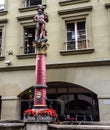 Beautiful City Street View of the colorful medieval Rifleman statue on top of elaborate fountain in Bern, Switzerland. Royalty Free Stock Photo