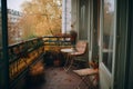 Beautiful city terrace with table and chair in autumn. Place for relaxation