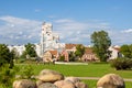 Summer landscape with old houses on the background of modern high-rise buildings Royalty Free Stock Photo