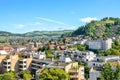 Beautiful cityscape of historical city Thun in Switzerland. Houses in the valley surrounded by green hills. The town located at Royalty Free Stock Photo