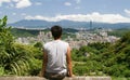 Beautiful cityscape with a man sit and watch far a