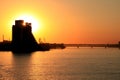 Beautiful cityscape at night. Evening silhouette of building skyscraper and a bridge on the river at sunset in the Ukrainian city Royalty Free Stock Photo