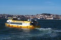 Beautiful cityscape panorama of Lisbon seen from Tejo river with a yellow boat