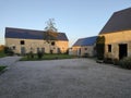 Beautiful classic French farmhouse, old stone and wood architecture with a well-kept courtyard.