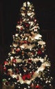 Black Artificial Christmas Tree Decorated With Decorations And Lights