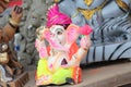 A Beautiful clay statue/Idol of an Indian god Lord Ganesha decorated with colorful drapery and Marigold garland Royalty Free Stock Photo