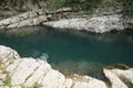 Beautiful clean pond between big cliffs outdoors