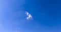 A beautiful clear blue sky with a single cloud, perfect for background use or environmental themes. Ideal for projects emphas Royalty Free Stock Photo