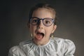 Beautiful clever, little girl with glasses, studio portrait on black background. Smart preschooler, doctor or teacher Royalty Free Stock Photo