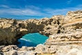 Beautiful cliffs on atlantic coastline with turquoise ocean wave erosion caves background in vivid colors in biarritz, basque cou