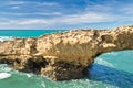 Beautiful cliffs on atlantic coastline with turquoise ocean wave erosion caves background in vivid colors in biarritz, basque cou