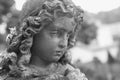 Beautiful close up af a face angel stone sculpture with a sweet Royalty Free Stock Photo