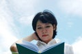 Beautiful close up Asia woman holding and reading book. Royalty Free Stock Photo