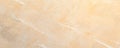 A beautiful closeup of a light beige marble surface showcasing elegant natural patterns and textures Royalty Free Stock Photo