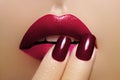 Beautiful Close-up Lips with Fashion Red Makeup. Beauty Lip Visage. Passionate kiss. Bright Cherry Lipstick and Manicure