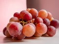 Beautiful close-up photo of a branch of a tasty red grapes lying on the table Royalty Free Stock Photo