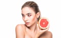 Beautiful portrait of young woman with grapefruit. Healthy food concept. Skin care and beauty. Royalty Free Stock Photo