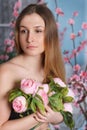 Beautiful close-up portrait of a young woman with peonies Royalty Free Stock Photo