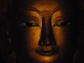 Beautiful close up of a statue of buddha`s face in the buddhist temple Yangon