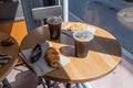 Beautiful close up view of round table with two coffee cups and pies Royalty Free Stock Photo