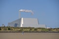 Beautiful closeup bright view of Covanta Plant Dublin Waste to Energy against clear blue sky seen from Sandymount Beach