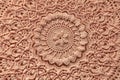 Beautiful closeup crochet pink doily on wooden background