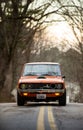 Beautiful closeup of a 1974 Datsun 620 Pickup Truck on a road Royalty Free Stock Photo