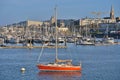 Beautiful closeup evening view of red boat and yachts moored at West Pier of Dun Laoghaire harbor, Dublin, Ireland Royalty Free Stock Photo