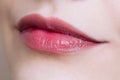 Beautiful closeup female plump lips with bright color makeup