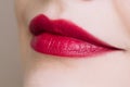 Beautiful closeup female plump lips with bright color makeup