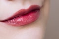 Beautiful closeup female plump lips with bright color makeup