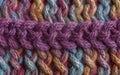 Beautiful closeup of a hand knitted wool pattern. Colorful yarn background.