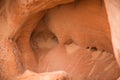 A beautiful closeup of a sandstone cliffs in Latvia. Close pattern of a sand formations. Sandstone caves at the seaside.