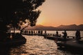 Beautiful closeup shot of people gathered at the dock at sunset Royalty Free Stock Photo