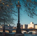 Beautiful closeup of street lamp with modern city in the background Royalty Free Stock Photo