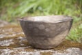 Beautiful closeup of three unique bowl of black pottery in summer morning sunlight Royalty Free Stock Photo