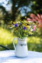 Beautiful closeup of a vase of wildflowers on a table Royalty Free Stock Photo