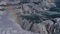 Beautiful closeup view of majestic cascade Gullfoss in southwest Iceland, part of Golden Circle, in winter with rainbow.