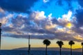 Beautiful cloud texture at Durdle Door sea beach with three palm trees. Royalty Free Stock Photo