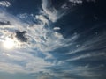 White clouds disappear in the hot sun on blue sky. Clouds on blue sky background. Weather nature blue sky with white cloud and sun Royalty Free Stock Photo