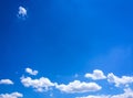 White clouds disappear in the hot sun on blue sky. Clouds on blue sky background. Weather nature blue sky with white cloud and sun Royalty Free Stock Photo