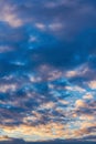 Beautiful clouds in blue sky, illuminated by rays of sun at colorful sunset to change weather. Abstract meteorology Royalty Free Stock Photo